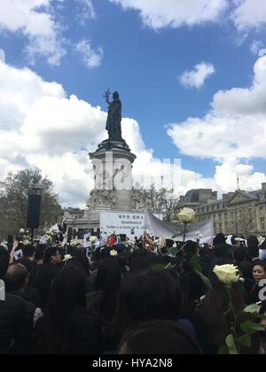 Paris, France. 2nd Apr, 2017. People attend a gathering to mourn Liu Shaoyao in Paris, France, on April 2, 2017. Thousands people from Chinese community gathered in Paris on Sunday to mourn the death of Liu Shaoyao, a Chinese national who was shot dead a week ago by a policeman at his home in the French capital. Credit: Ying Qiang/Xinhua/Alamy Live News Stock Photo