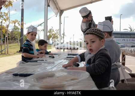 Kfar Chabad, Israel. 3rd April, 2017. A workshop for preparation of matzah operates outside '770' in the village of Kfar Chabad, a replica of the Chabad Lubavitz headquarters at 770 Eastern Parkway, Crown Heights, Brooklyn, New York. Credit: Nir Alon/Alamy Live News Stock Photo