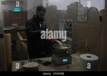 Kfar Chabad, Israel. 3rd April, 2017. Men prepare hand made matzah in the Chabad Matzah Bakery in the village of Kfar Chabad. Credit: Nir Alon/Alamy Live News Stock Photo