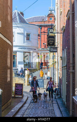 A couple of ladies walk their dogs down Goswell Hill, a pedestrianised street in the centre of Windsor, Berkshire, UK. Stock Photo