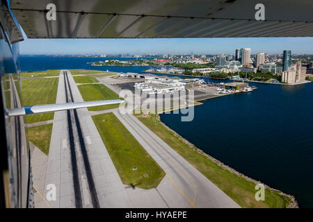 A view from a small plane looking back at the runway and airport terminal at Billy Bishop Airport in Toronto. Stock Photo