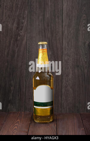 bottle of beer on a wooden background Stock Photo