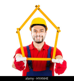 new house and improvement concept - construction worker with wooden ruler in hands Stock Photo