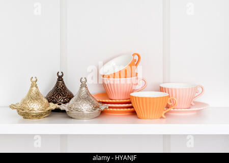 Golden, bronze and silver cups to serve Turkish delight and coffee cups Stock Photo