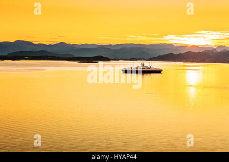 Sunrise over the mountains and the sea in Norway. Stock Photo