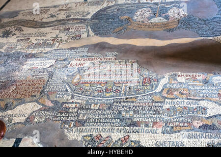 MADABA, JORDAN - FEBRUARY,20, 2012: floor in Greek Orthodox Basilica of St George in Madaba city with early Byzantine mosaic map of the Holy Land. The Stock Photo