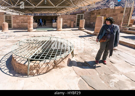 PETRA, JORDAN - FEBRUARY 21, 2012: tourists in Byzantine church in ancient Petra town. Rock-cut town Petra was established about 312 BC as the capital Stock Photo