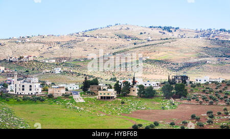 Travel to Middle East country Kingdom of Jordan - view of village and terraced gardens in Jordan in winter Stock Photo