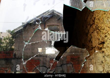 A broken window of an abandoned building near Brito Capelo street in Matosinhos, Porto, Portugal. Stock Photo