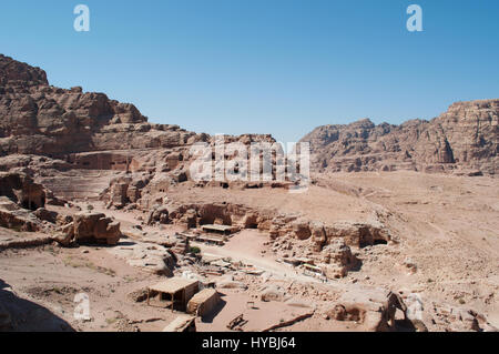 Jordan: the Roman amphitheater, a great theatre carved in the rock with view of the desertic jordanian landscape in the archaeological valley of Petra Stock Photo