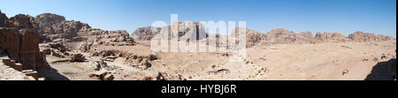 Jordan: the Roman amphitheater, a great theatre carved in the rock with view of the desertic jordanian landscape in the archaeological valley of Petra Stock Photo