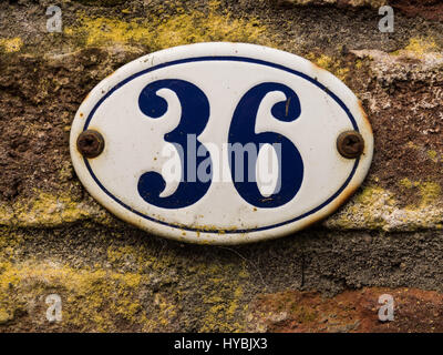 enameled old house number 36 in wihte and blue Stock Photo
