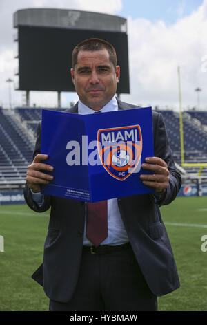 Riccardo Silva holds for a photo in Florida International University's newly renamed Ricardo Silva Stadium in Miami, Florida on April 3, 2017 Stock Photo