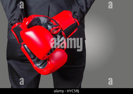 Businessmen with boxing gloves on gray background. Stock Photo