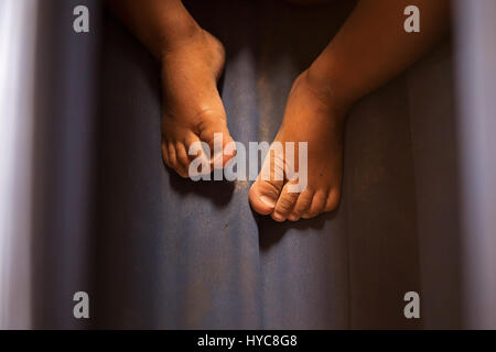 Cambodia, Siem Reap, Feet in Fish Massage Pool Stock Photo