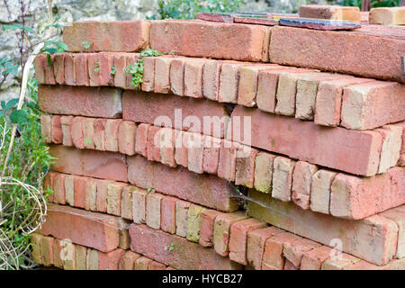 Stack of reclaimed bricks ready to be sold as second hand Stock Photo