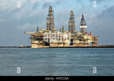 Deep water drill rigs temporarily in storage,  pm light, Harbor Island,  Canyon Port, Port Aransas. Stock Photo