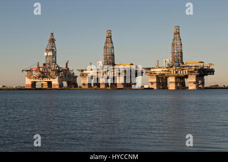 Deep water drill rigs temporarily in storage,  pm light, Harbor Island,  Canyon Port, Port Aransas. Stock Photo
