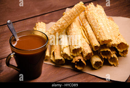 tubular wafer. waffles on wooden boards. hot chocolate Stock Photo