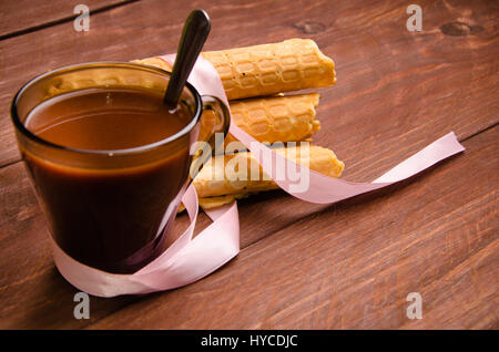 tubular wafer. hot chocolate. waffles on wooden boards Stock Photo
