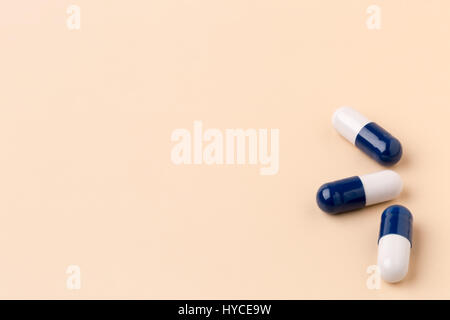 Various colorful pills on color background Stock Photo