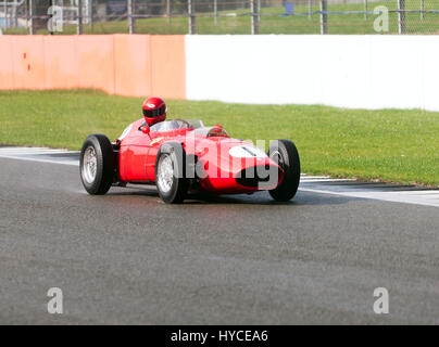 A classic 1958, Ferrari 246 F1 racing car, out for a test session  on the track during the Silverstone Classic Media Day Stock Photo