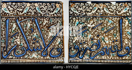 Mongol lustre tile 1310  Kashan  - Ilkhanid dynasty  (Asia,Iran,Central Iran, Isfahan) Rectangular frieze tile. blue, turquoise and lustre over an opaque white glaze. The upper border is decorated with a band of lotus and peony blossoms against a lustred background incised with spirals. The main register carries part of an inscription (including date) in molded relief, painted in blue against a lustered background of foliate scrollwork. The narrow lower border is divided into square compartments containing an abstract design. Some parts of the decoration are highlighted by splashes of turquois
