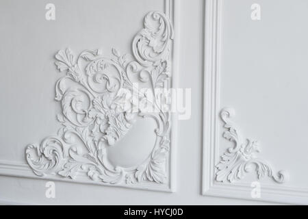 White wall molding with geometric shape and vanishing point. Luxury white wall design bas-relief with stucco mouldings roccoco element Stock Photo