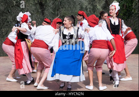 Folk dancers of Nice, France performing a traditional dance of the Alpes-Maritime region in authentic costumes of the area. Stock Photo