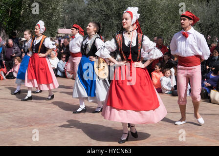 Folk dancers of Nice, France performing a traditional dance of the Alpes-Maritime Region in authentic costumes of the area. Stock Photo