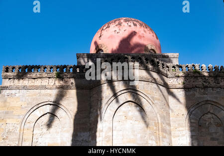 Shadow of a palm tree falls over the arches and dome of San Cataldo Church in Palermo, Sicily. Stock Photo