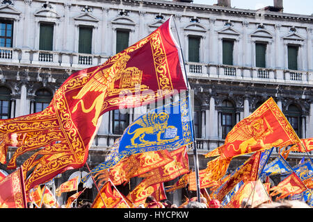 Revelers celebrate the Festa di San Marco, the feast day of Venice's patron saint in the Piazza San Marco Stock Photo