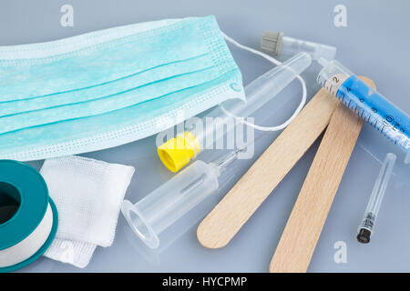 Syringes and needles and other medical items. Healthcare or pharmacy themes.