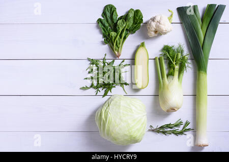 Green colour vegetables on white background. Detox diet veggies. Healthy diet concept. High angle view, copy space. Stock Photo
