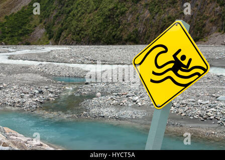 Sign showing drowning man in river warning against flash floods Stock Photo