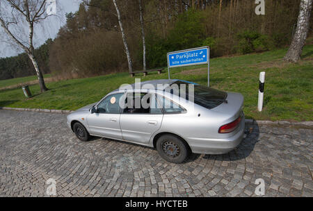 Smashed car window on a public paking space Stock Photo