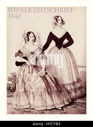 Vienna 1840 fashion; two young ladies fancy dressed with hat and haido sitting outdoors Stock Photo