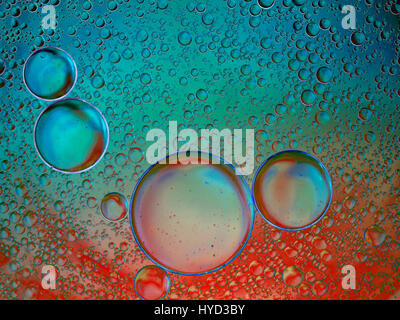 Red and turquoise bubbly background. Looks 3d. Stock Photo