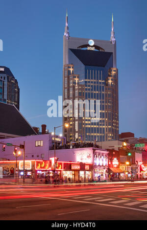 AT&T Building towers over music clubs along lower Broadway in downtown Nashville, Tennessee, USA Stock Photo