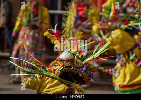 Tinkus dancers in colourful costumes at the annual Oruro Carnival. The event is designated by UNESCO as Intangible Cultural Heritage of Humanity. Stock Photo