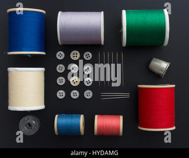 Studio shot of colorful sewing tools on black background Stock Photo