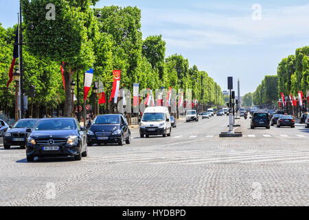 Paris, France , May 18, 2015:   perspective of Champs Elysees near the metro Franklin D. Roosevelt, hard traffic and view to the square Concorde Stock Photo