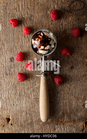 A Chocolate Ice Cream Sundae With Chocolate Syrup And Rainbow Sprinkles 