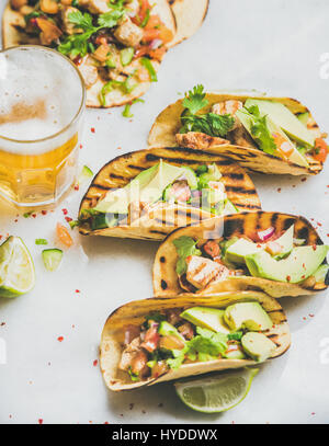 Healthy corn tortillas with grilled chicken fillet, avocado and beer Stock Photo