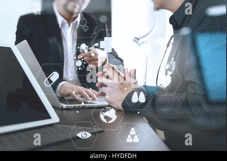 Medical and health care concept,Doctor meeting with his team in modern office at hospital with virtual interface icon screen Stock Photo