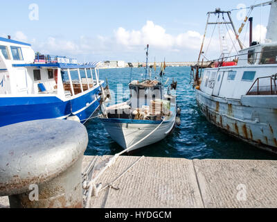 Oneglia, Italy - June 14, 2015: Marina and fishing. Several fishing boats are moored. In the background the buildings typical of Oneglia. Stock Photo