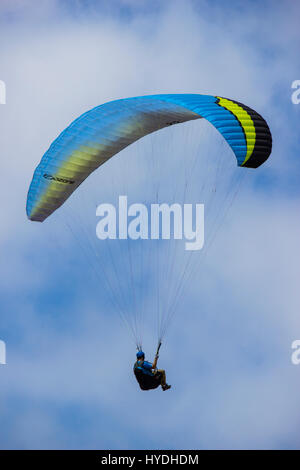 Para-glider in flight over the ocean Stock Photo