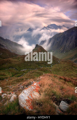 Taken on a evening at the end of August, one hour before sunset, looking down to the valley from the Col dell'Agnello, a pass at more than 2700 m. lin Stock Photo