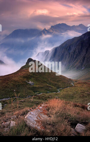 Taken on a evening at the end of August, one hour before sunset, looking down to the valley from the Col dell'Agnello, a pass at more than 2700 m. lin Stock Photo