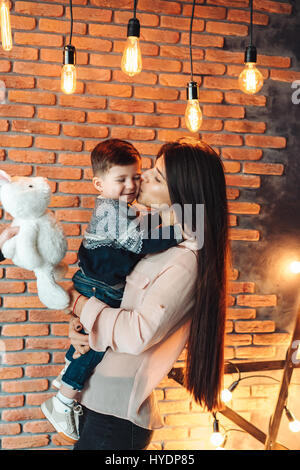 Mother and young son posing at hone Stock Photo - Alamy